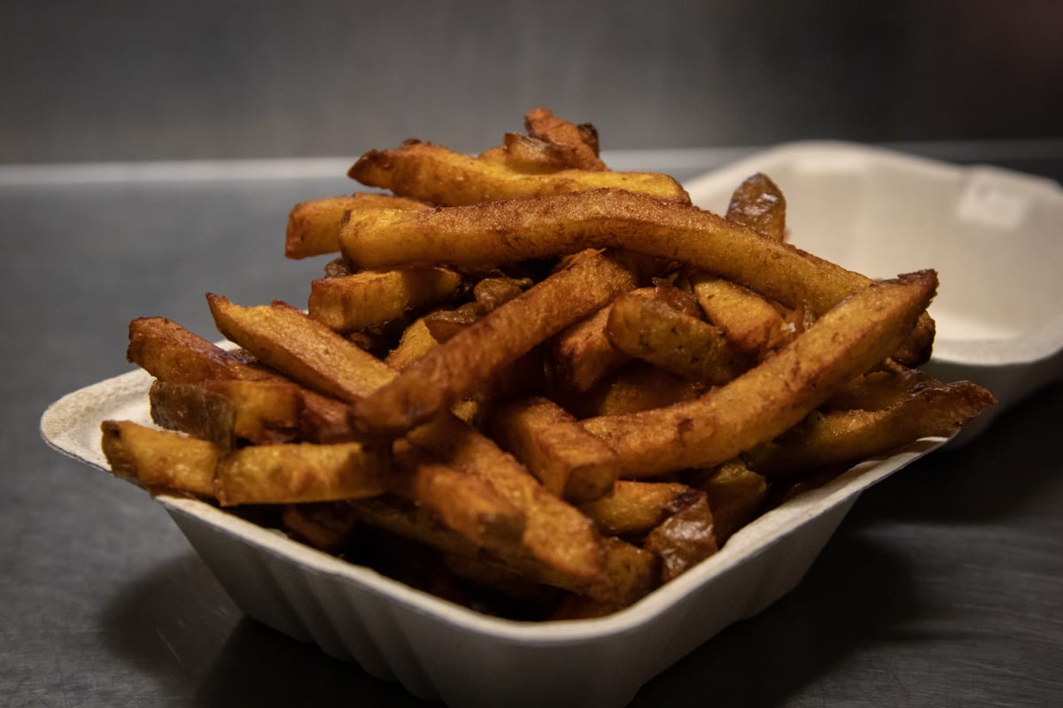 A tray of fresh cut fries
